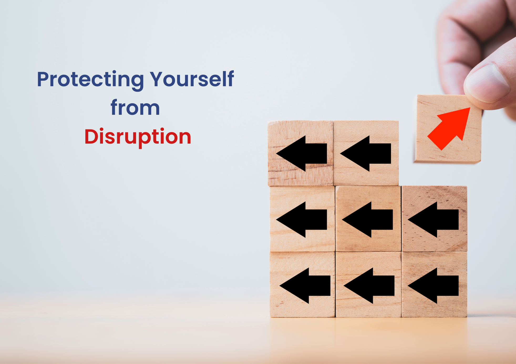 a hand placing a block with a red arrow among blocks with black arrows. The text above reads "Protecting Yourself from Disruption," with "Disruption" in red.